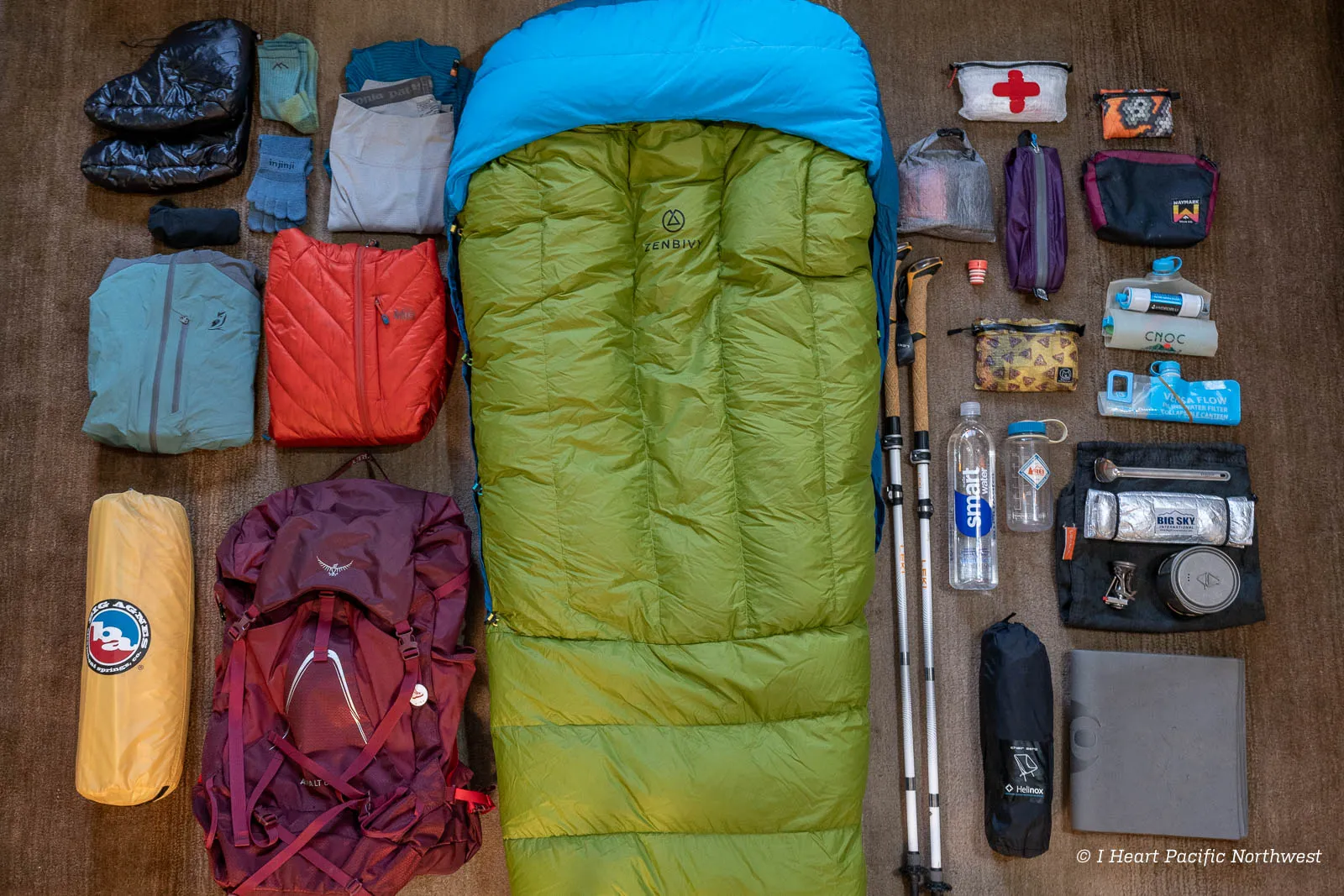 Essential backpacking gear laid out for organization
